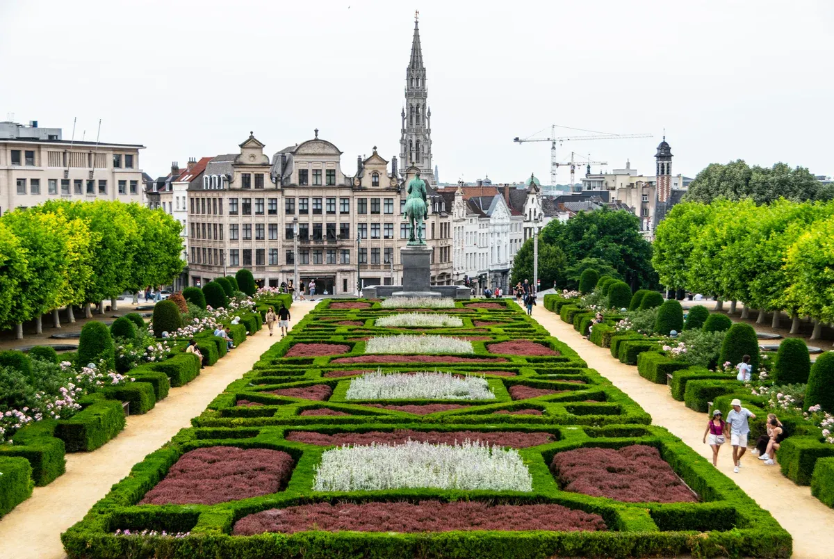 Mont des Arts gardens with the Town Hall spire behind, a viewpoint on a history chocolate tour in Brussels
